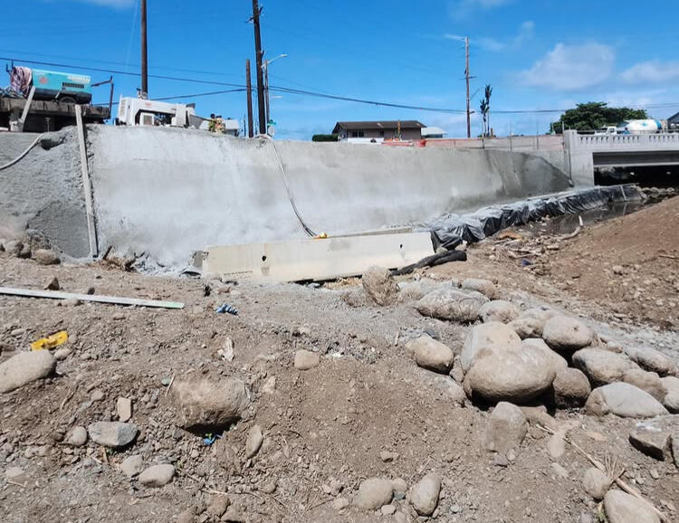 Concrete channel wall beside Hauula Bridge during construction