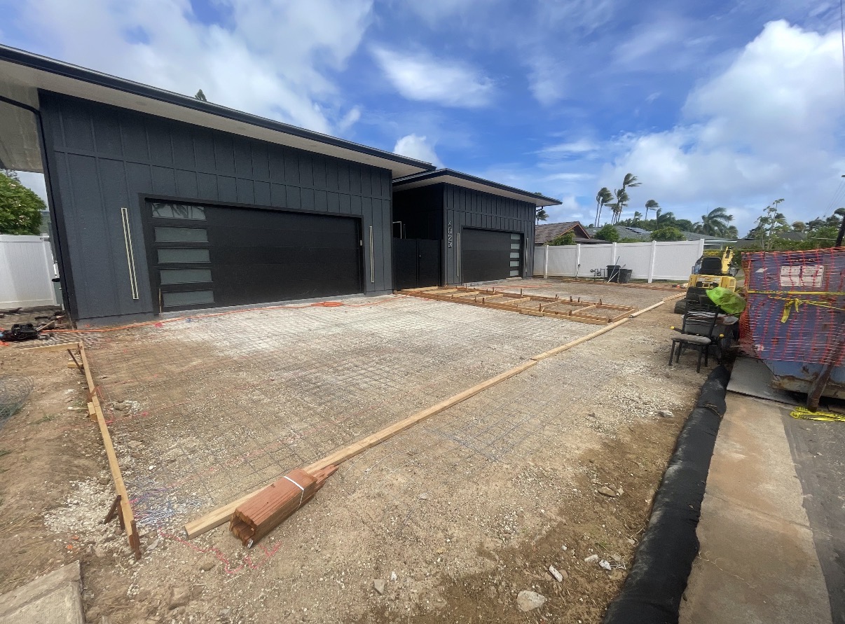 Driveway formwork and reinforcing mesh before concrete placement